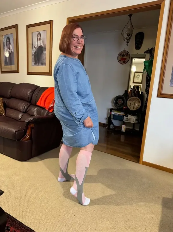 Stack of Nurse Yard compression socks in multiple colors and patterns