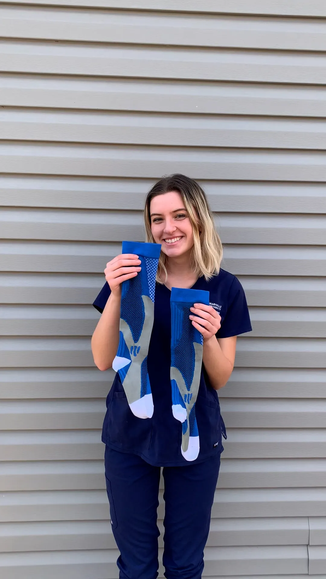 Nurse showing compression socks results